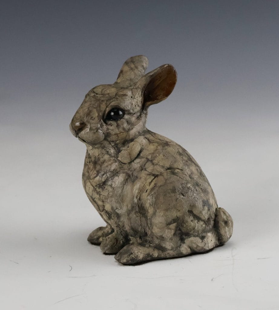 Blosson bronze bunny sculpture by Mark Dziewior at 7 Mile Creek Studio.