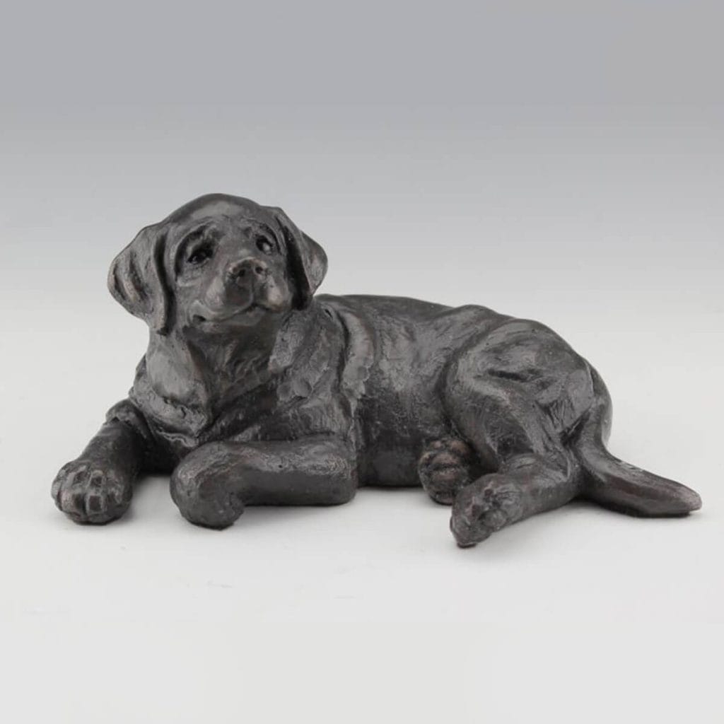 Just Chillin' bronze dog sculpture by Mark Dziewior at 7 Mile Creek Studio.
