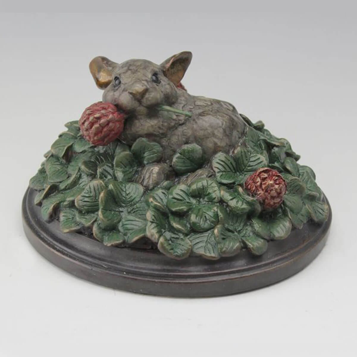 Rolling in Clover bronze rabbit sculpture by Mark Dziewior at 7 Mile Creek Studio.