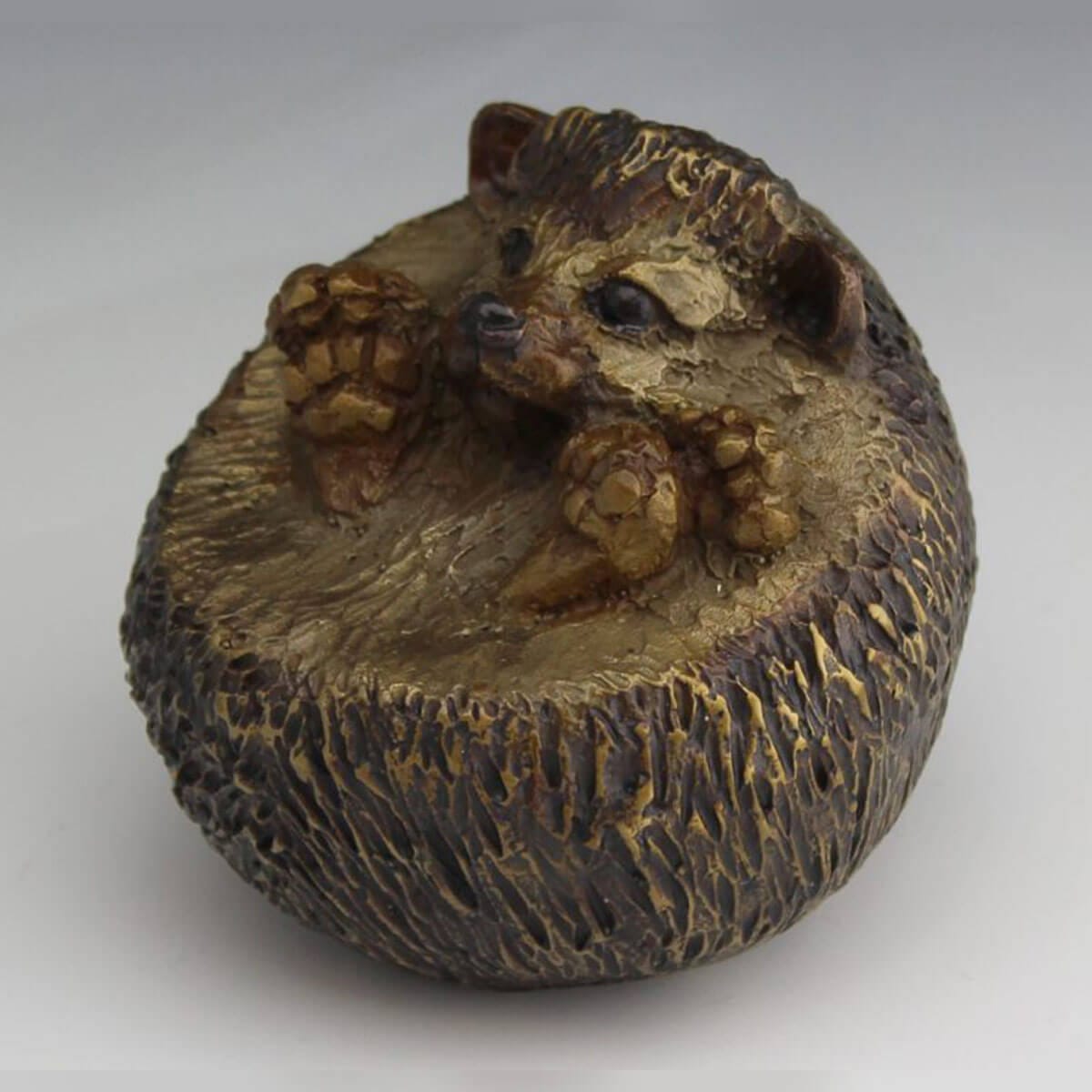 Tuck and Roll bronze bear cub sculpture by Mark Dziewior at 7 Mile Creek Studio.